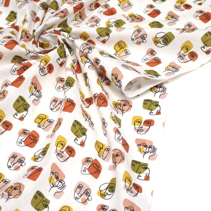Tissu cotonnade blanc aux visages façon PABLO - OEKO - TEX - TissusPapi.com