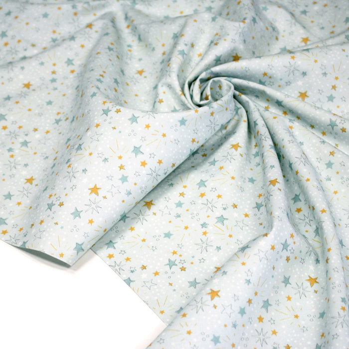 Tissu cotonnade bleu ciel aux fines étoiles jaunes et bleues - OEKO - TEX STANDARD 100 - TissusPapi.com