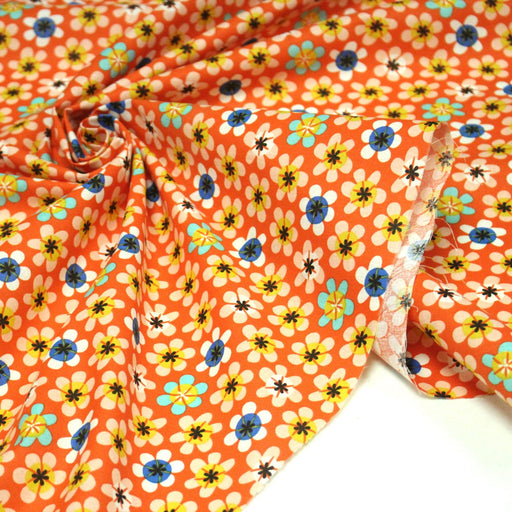 Tissu cotonnade orange aux fleurs multicolores - OEKO - TEX STANDARD 100 - TissusPapi.com