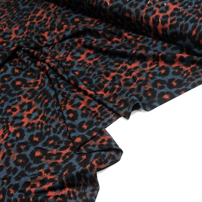 Tissu habillement motif léopard bleu pétrole, rouille et noir - TissusPapi.com