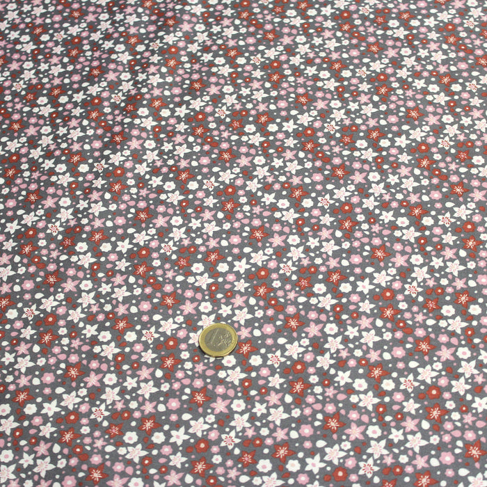 Tissu popeline de coton fleuri gris aux fleurs roses, rouille et blanches