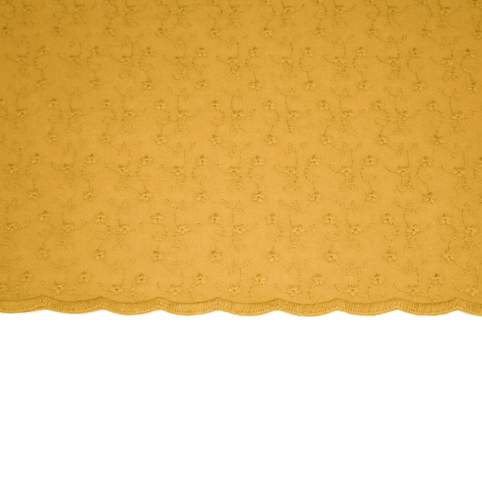 Tissu broderie anglaise fleurie 100% coton jaune safran, à double feston