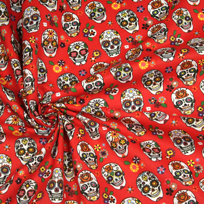 Tissu de coton aux crânes et fleurs de couleurs, fond rouge - COLLECTION CALAVERAS