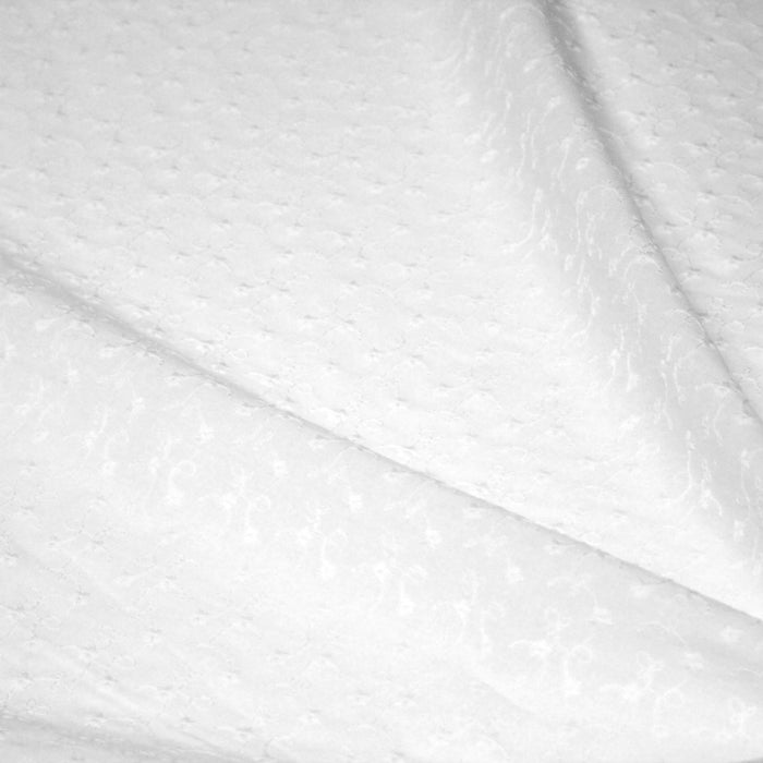 Tissu broderie anglaise fleurie 100% coton blanc, à double feston