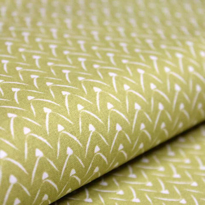 Tissu de coton aux motifs graphiques blancs, fond vert anis - OEKO-TEX®