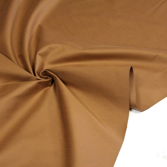 Tissu satin de coton élasthanne ocre uni