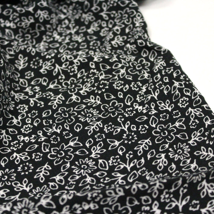 Tissu viscose fluide fond noir aux fines fleurs blanches - OEKO-TEX®