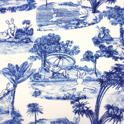 Tissu Toile de jouy de coton aux motifs Lapinous coquins bleus - TissusPapi.com