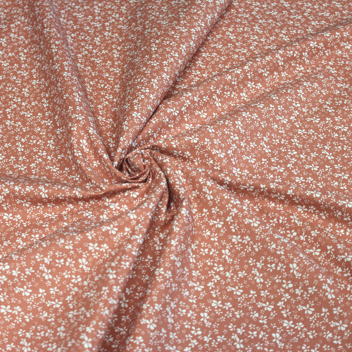 Tissu de coton corail aux fleurs blanches - OEKO-TEX