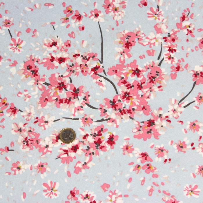 Tissu de coton bleu ciel aux fines fleurs de cerisiers japonais roses - COLLECTION CHERRY BLOSSOM GIRL - OEKO-TEX
