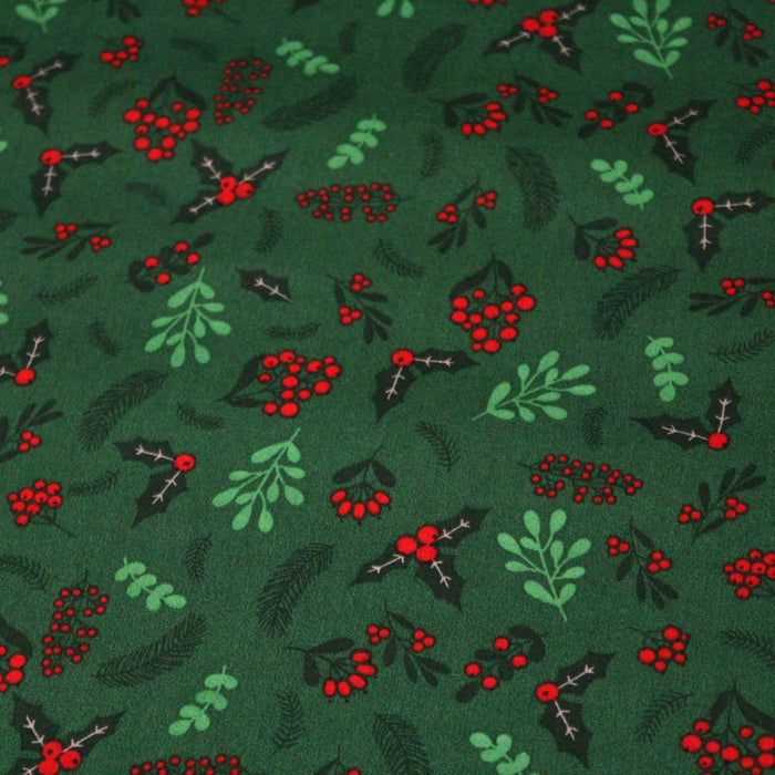 Tissu de coton de Noël vert aux feuilles de houx vertes et branches de sapins verts - COLLECTION NOËL - OEKO - TEX - TissusPapi.com