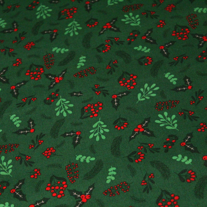 Tissu de coton de Noël vert aux feuilles de houx vertes et branches de sapins verts - COLLECTION NOËL - OEKO - TEX - TissusPapi.com