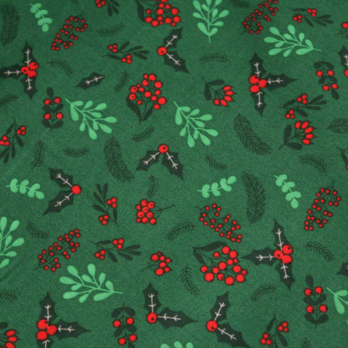 Tissu de coton de Noël vert aux feuilles de houx vertes et branches de sapins verts - COLLECTION NOËL - OEKO - TEX - TissusPapi.com