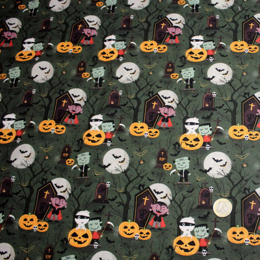 Tissu coton vert aux citrouilles et cimetières - Collection Halloween - OEKO - TEX - TissusPapi.com
