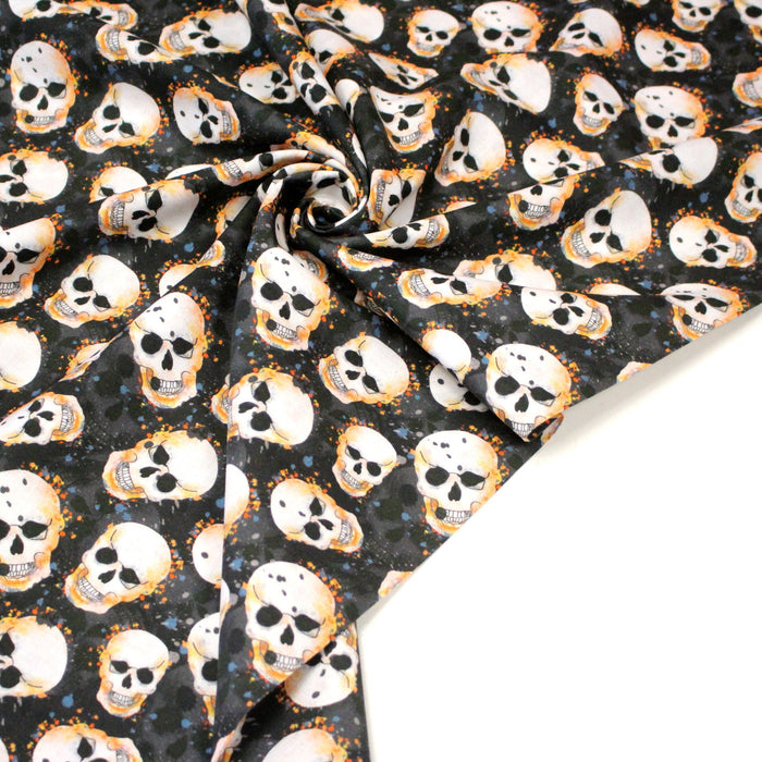Tissu coton noir aux crânes et têtes de mort oranges - Collection Halloween - OEKO - TEX - TissusPapi.com