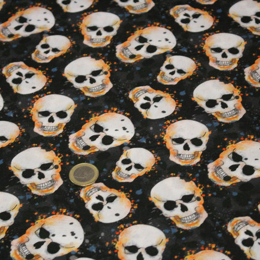 Tissu coton noir aux crânes et têtes de mort oranges - Collection Halloween - OEKO - TEX - TissusPapi.com