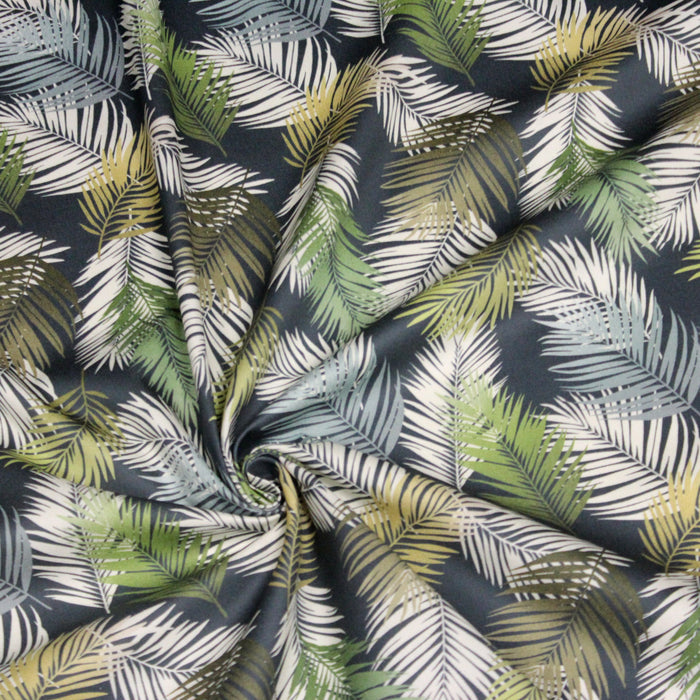 Tissu gabardine de coton LUXE imprimée motif feuillage tropical blanc & vert, fond bleu pétrole
