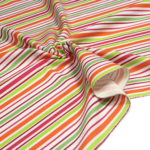 Tissu Bayadère de coton aux rayures oranges, rouges et roses, fond blanc - TissusPapi.com