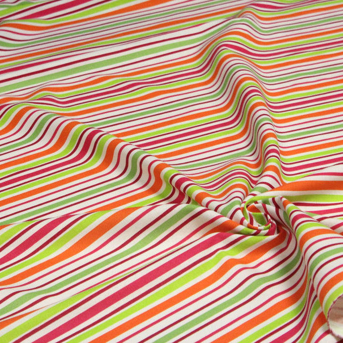 Tissu Bayadère de coton aux rayures oranges, rouges et roses, fond blanc - TissusPapi.com