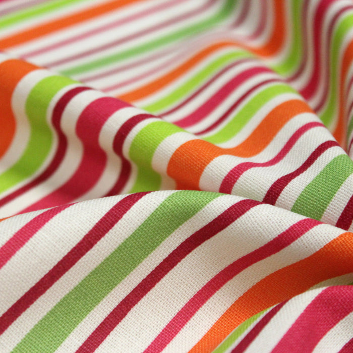 Tissu Bayadère de coton aux rayures oranges, rouges et roses, fond blanc - TissusPapi.com