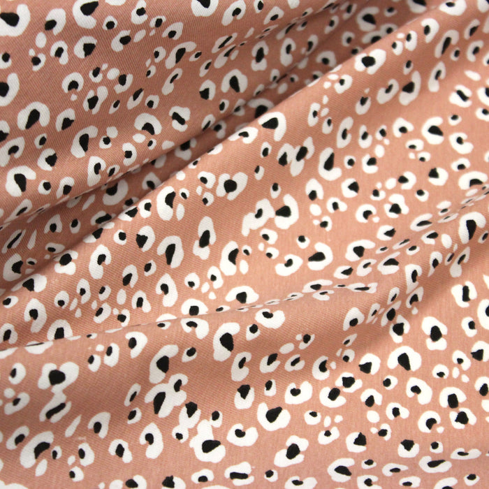 Tissu jersey de coton motif Léopard noir & blanc, fond vieux rose - OEKO-TEX