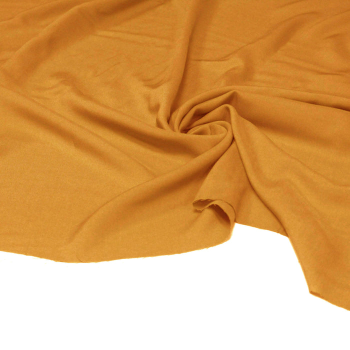 Tissu viscose fluide jaune ocre uni - Fabrication française