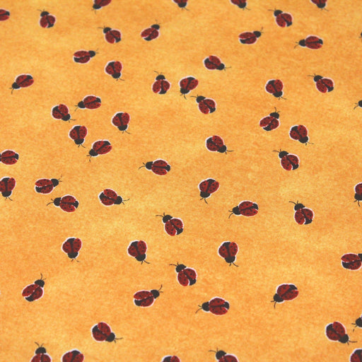Tissu popeline de coton aux petites coccinelles rouges, fond jaune safran - TissusPapi.com
