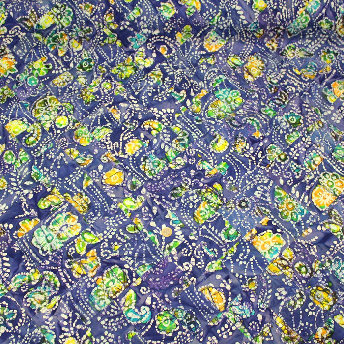 Tissu de coton batik patchwork aux fleurs, formes et pois blancs & jaunes, fond bleu roi - TissusPapi.com