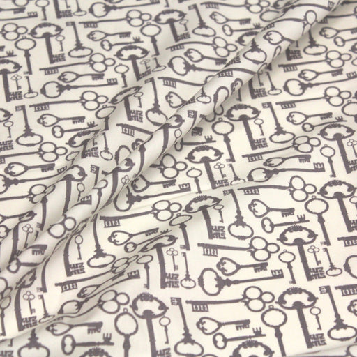 Tissu popeline de coton aux clefs vintage taupe, fond écru - TissusPapi.com