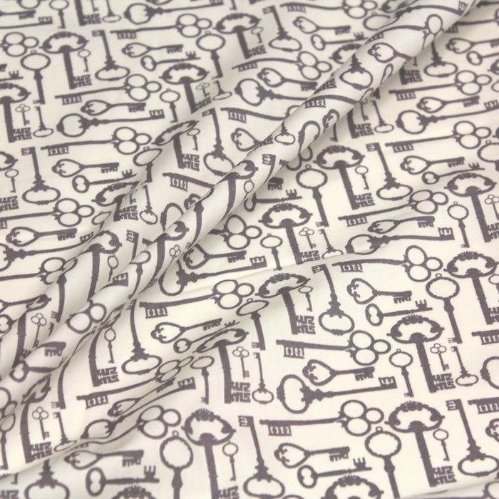 Tissu popeline de coton aux clefs vintage taupe, fond écru - TissusPapi.com