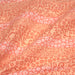 Tissu de coton batik patchwork aux fleurs variées, tons orange et pêche - tissuspapi