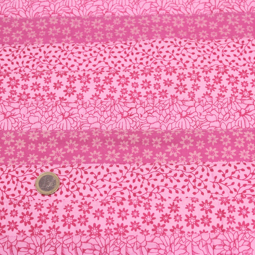 Tissu de coton batik patchwork aux fleurs variées, tons rose et rose fuchsia - TissusPapi.com