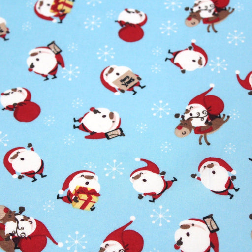 Tissu popeline de coton de Noël - Le père Noël, fond bleu ciel - TissusPapi.com