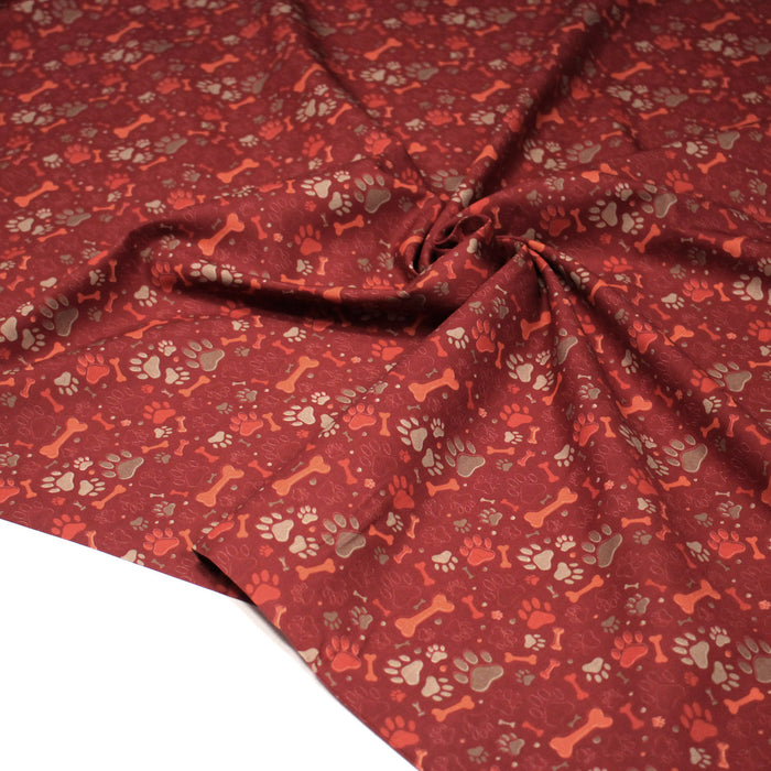 Tissu cotonnade rouge TOUTOU : empreintes de chien & gros os - OEKO-TEX