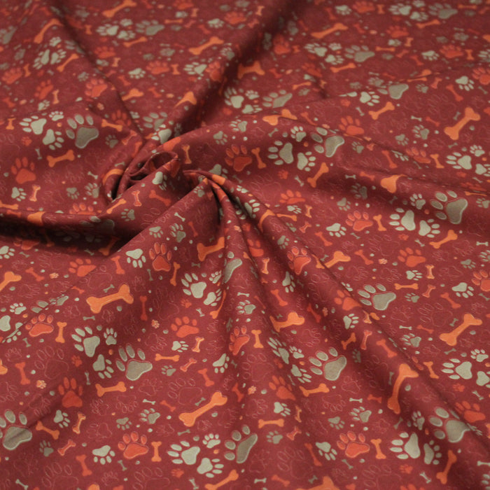 Tissu cotonnade rouge TOUTOU : empreintes de chien & gros os - OEKO-TEX