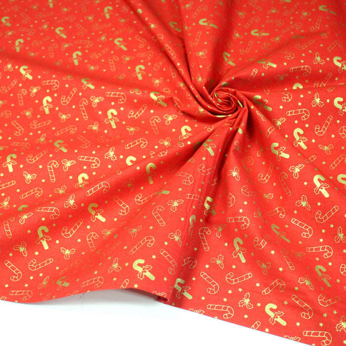 Tissu coton NOËL rouge aux houx et sucres d'orge dorés - OEKO-TEX