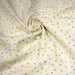 Tissu popeline coton écru aux pois et étoiles multicolores - TissusPapi.com