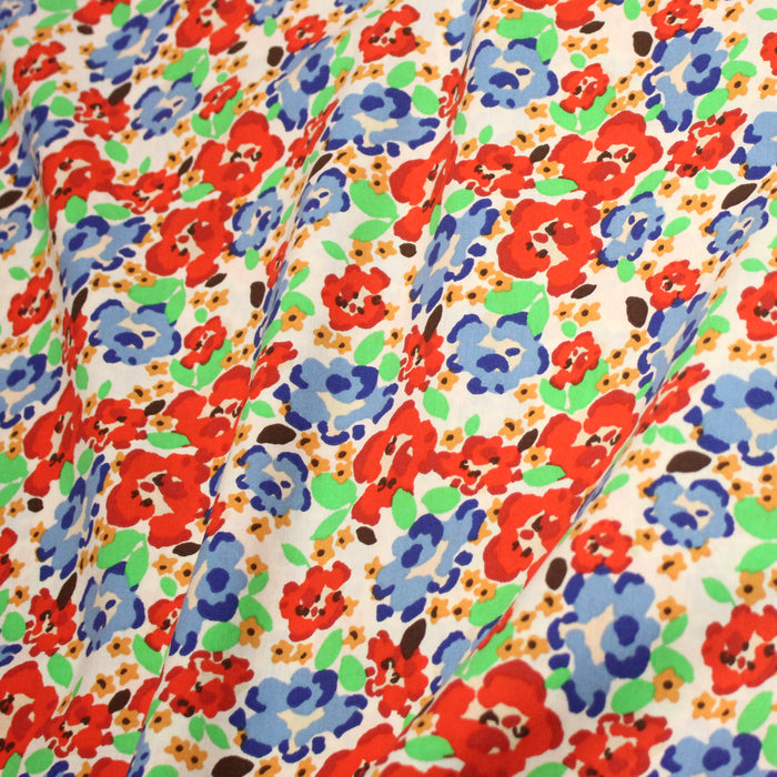 Tissu cotonnade aux fleurs graphiques rouges, bleues, vertes, fond écru - OEKO-TEX STANDARD 100