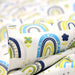 Tissu popeline coton blanc aux arcs en ciel verts bleus et jaunes - TissusPapi.com
