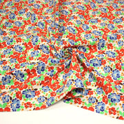 Tissu cotonnade aux fleurs graphiques rouges, bleues, vertes, fond écru - OEKO - TEX STANDARD 100 - TissusPapi.com