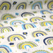 Tissu popeline coton blanc aux arcs en ciel verts bleus et jaunes - TissusPapi.com