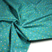 Tissu popeline coton vert canard aux pois et étoiles multicolores - TissusPapi.com