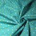 Tissu popeline coton vert canard aux pois et étoiles multicolores - TissusPapi.com