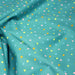 Tissu popeline coton vert canard aux pois et étoiles multicolores - TissusPapi.com
