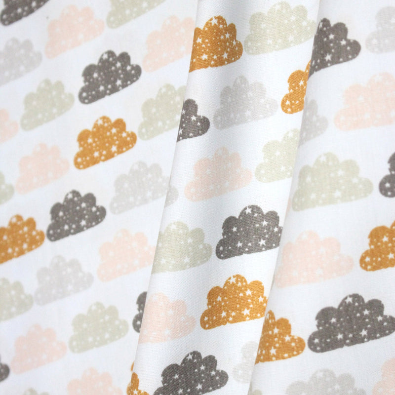 Tissu popeline coton rose bleu ciel aux nuages roses, gris et ocres - TissusPapi.com