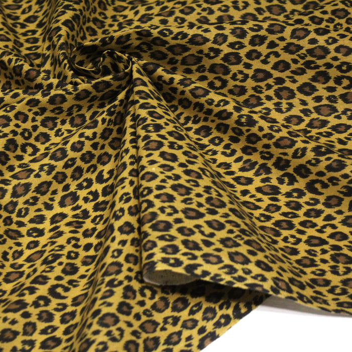 Tissu coton LEOPARD, taches noires et fauve, fond jaune moutarde - OEKO-TEX