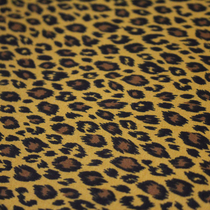 Tissu coton LEOPARD, taches noires et fauve, fond jaune moutarde - OEKO-TEX