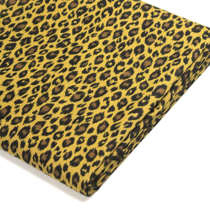 Tissu coton LEOPARD, taches noires et fauve, fond jaune moutarde - OEKO-TEX