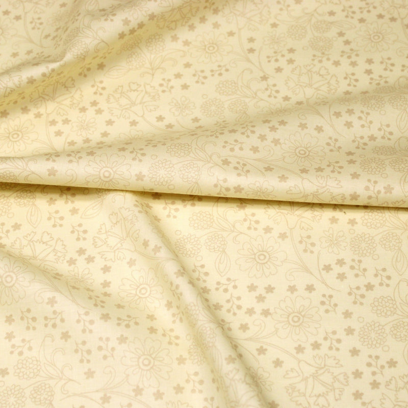 Tissu popeline de coton jaune beurre aux fines fleurs beiges - TissusPapi.com