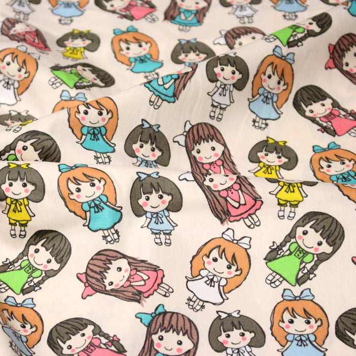 Tissu popeline coton aux petits filles façon bande dessinée - TissusPapi.com